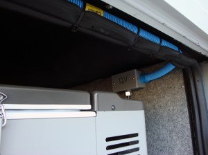 Running conduit along the top of the basement doors